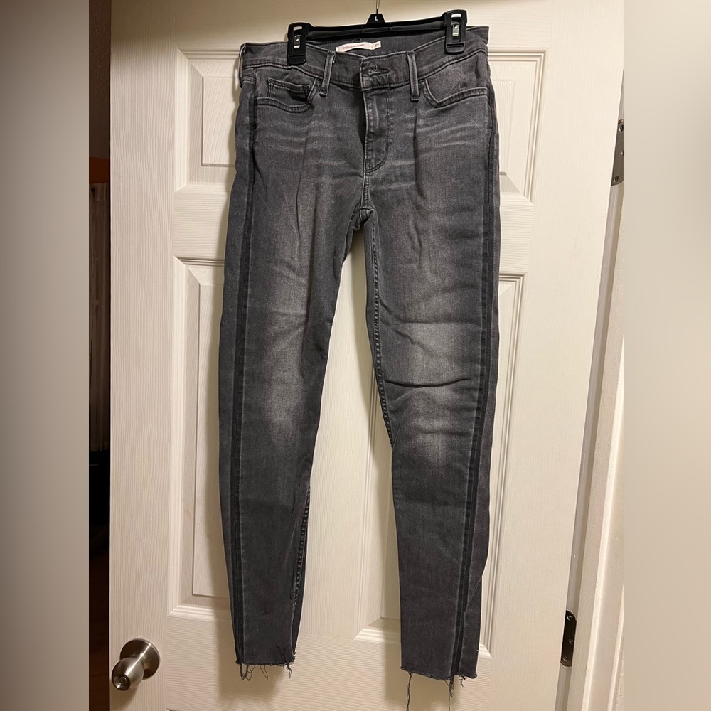 Levi’s 710 super skinny jeans in faded black, size 29, raw hem, stretch fit
